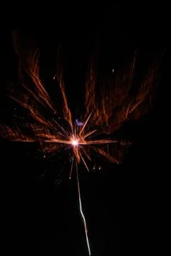 Multicolored fireworks exploding on the sky for New Year Celebration Stock Photos