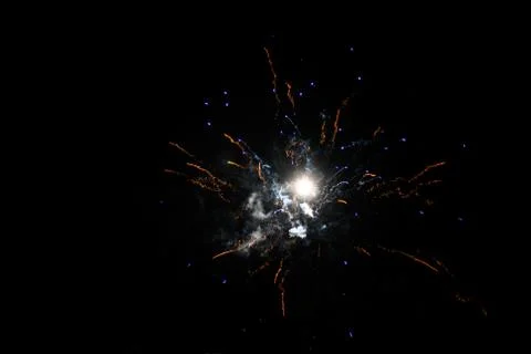 Multicolored fireworks exploding on the sky for New Year Celebration Stock Photos