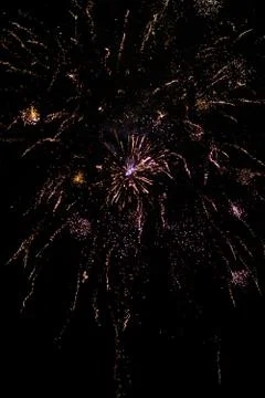 Multicolored fireworks exploding on the sky for New Year Celebration Stock Photos