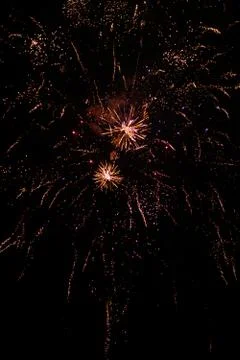 Multicolored fireworks exploding on the sky for New Year Celebration Stock Photos