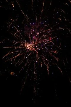 Multicolored fireworks exploding on the sky for New Year Celebration Stock Photos