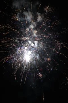 Multicolored fireworks exploding on the sky for New Year Celebration Stock Photos
