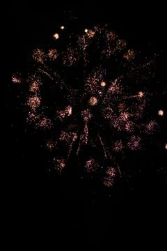 Multicolored fireworks exploding on the sky for New Year Celebration Stock Photos