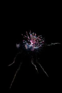 Multicolored fireworks exploding on the sky for New Year Celebration Stock Photos