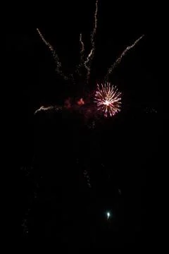 Multicolored fireworks exploding on the sky for New Year Celebration Stock Photos