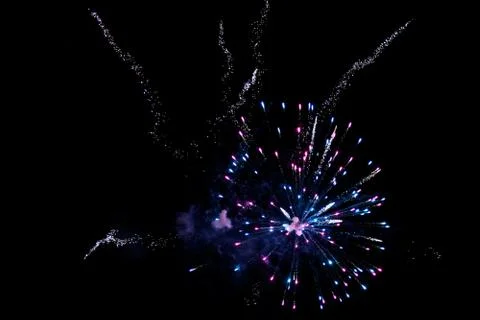 Multicolored fireworks exploding on the sky for New Year Celebration Stock Photos