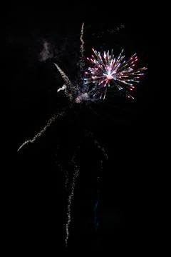 Multicolored fireworks exploding on the sky for New Year Celebration Stock Photos