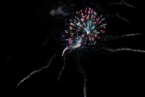 Multicolored fireworks exploding on the sky for New Year Celebration Stock Photos