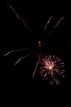 Multicolored fireworks exploding on the sky for New Year Celebration Stock Photos