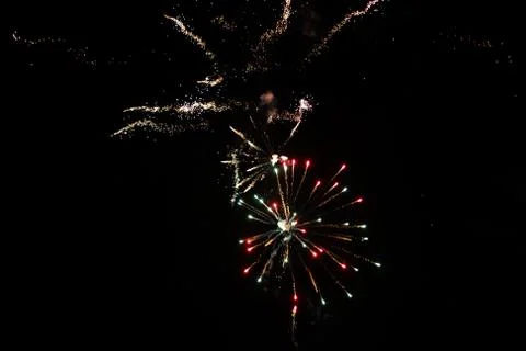Multicolored fireworks exploding on the sky for New Year Celebration Stock Photos