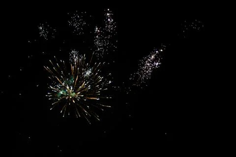 Multicolored fireworks exploding on the sky for New Year Celebration Stock Photos