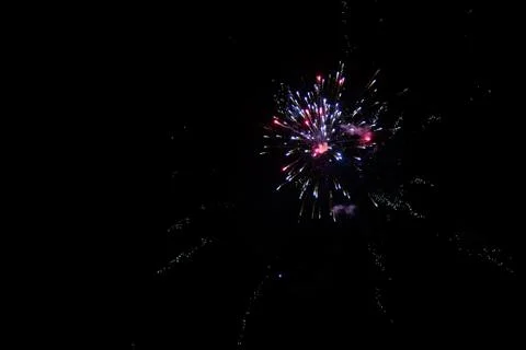 Multicolored fireworks exploding on the sky for New Year Celebration Stock Photos