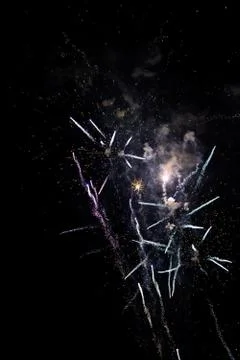 Multicolored fireworks exploding on the sky for New Year Celebration Stock Photos