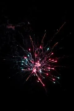 Multicolored fireworks exploding on the sky for New Year Celebration Stock Photos