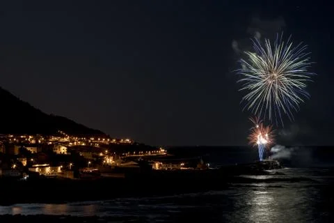 Multicolored fireworks exploding in the sky at night Foto stock