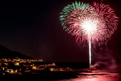 Multicolored fireworks exploding in the sky at night Foto stock
