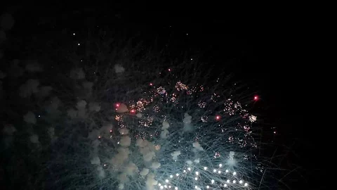Multicolored fireworks in the night sky over German city in honor of city day Stock Footage 114059333
