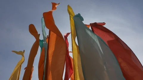Multicolored flags clap in the wind. Stock Footage 97812529