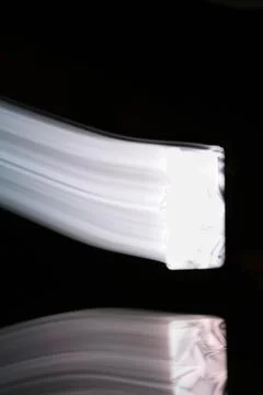 Multicolored flow on a black background Stock Photos