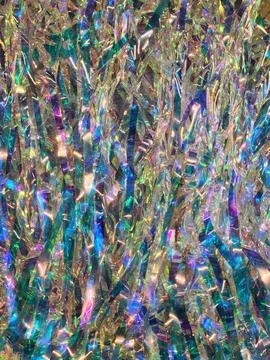 Multicolored foil backdrop. Festive backdrop made of glittery ribbons Stock Photos