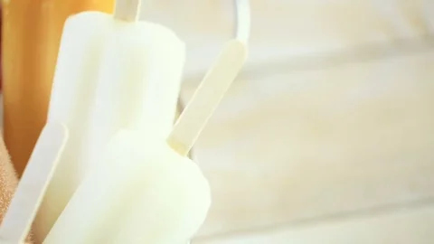 Multicolored fruit ice cream bars on metal tray with ice. Stock Footage