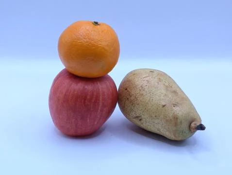 Multicolored fruits composition on a light background close-up Stock Photos