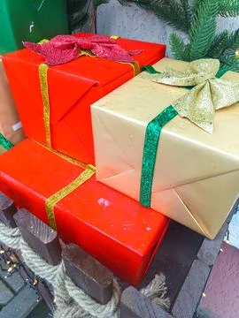 Multicolored gift boxes with ribbons. Outside. Stock Photos