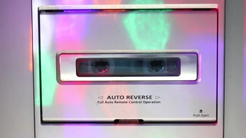 Multicolored glare on a cassette player playing music Stock Footage 163040403
