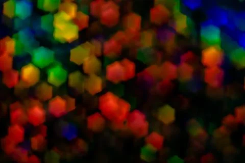 Multicolored glare in the shape of a hexagon. Abstract 3D background. Red, bl Stock Photos
