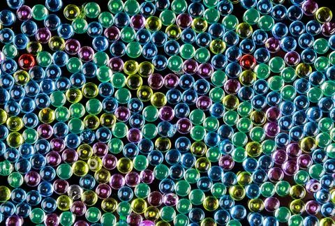 Multicolored glass pebbles as a background. Stock Photos