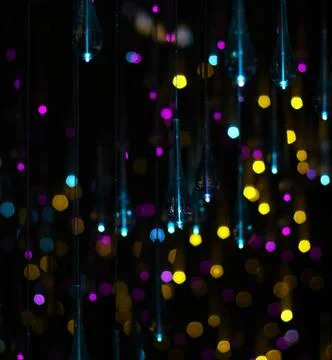 Multicolored glitter on black background Stock Photos