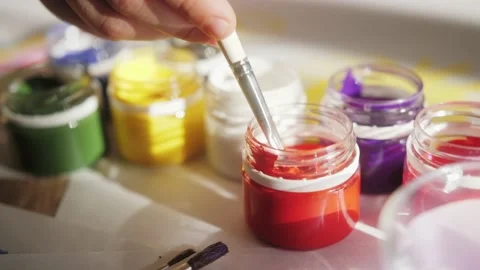 Multicolored gouache in small jars with tassel. Stock Footage 174749981
