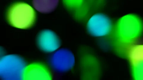 Multicolored green, emerald, blue light leaks on a black background Stock Footage 227180335