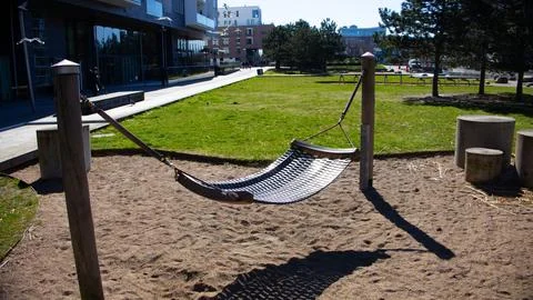 Multicolored hammock in backyard or outdoor playground Stock Photos