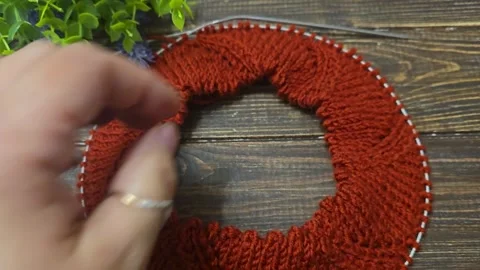 Multicolored hand-knitted fabric. Knitting and crochet lessons. Fashion Stock Footage 342231051