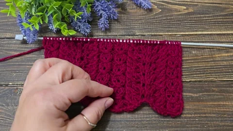 Multicolored hand-knitted fabric. Knitting and crochet lessons. Fashion Stock Footage 345023106