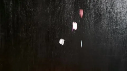 Multicolored hearts falling down on black background Stock Footage 227328987