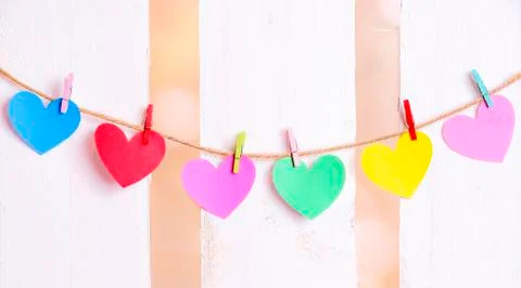 Multicolored hearts tied on a string Stock Photos