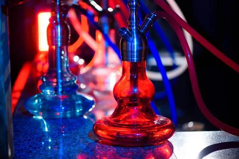 Multicolored hookah in the restaurant. Hookah elements on the background of the Stock Photos