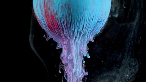 Multicolored ink paint slowly flows from the ball Video stock 104128847