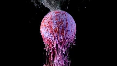Multicolored ink paint slowly flows from the ball Stock Footage 104144310