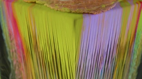 Multicolored ink paint slowly flows from the cube underwater Stock Footage 104154295