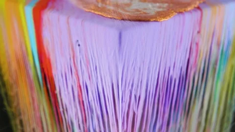 Multicolored ink paint slowly flows from the cube underwater Stock Footage 104155393