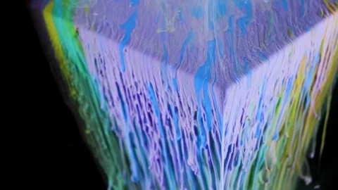 Multicolored ink paint slowly flows from the cube underwater Stock Footage 104157095