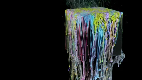 Multicolored ink paint slowly flows from the cube underwater Stock Footage 104171012