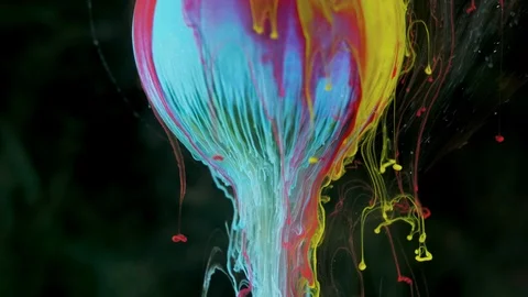 Multicolored ink paint slowly flows from the ball Stock Footage 104172837