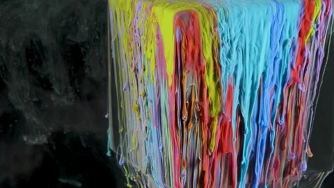 Multicolored ink paint slowly flows from the cube underwater Video stock 104174491