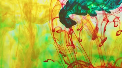 Multicolored inks spreading in water, forming whimsical patterns Video stock 246633485