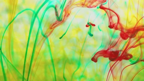Multicolored inks spreading in water, forming whimsical patterns Video stock 246847384