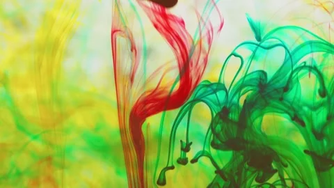 Multicolored inks spreading in water, forming whimsical patterns Video stock 246847480